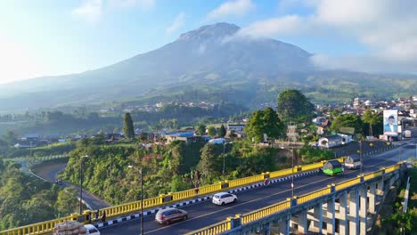 aerial beautiful indonesia rural landscape with view of sigandul bridge and sumbing mountain on the background