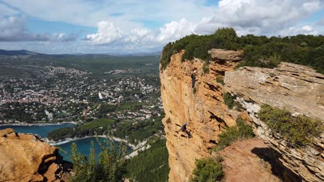 risk taking rock climbing hobby at cap canaille cliff wide shot