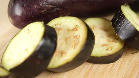 sliced eggplant on a bamboo cutting board