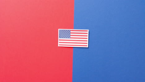 national flag of usa lying on red and blue background with copy space