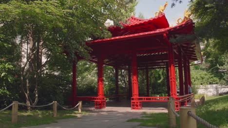 Steady shot of 5 continents park Jacques Chirac with chinese red architecture monument  in Levallois, France. Paris close suburbs.