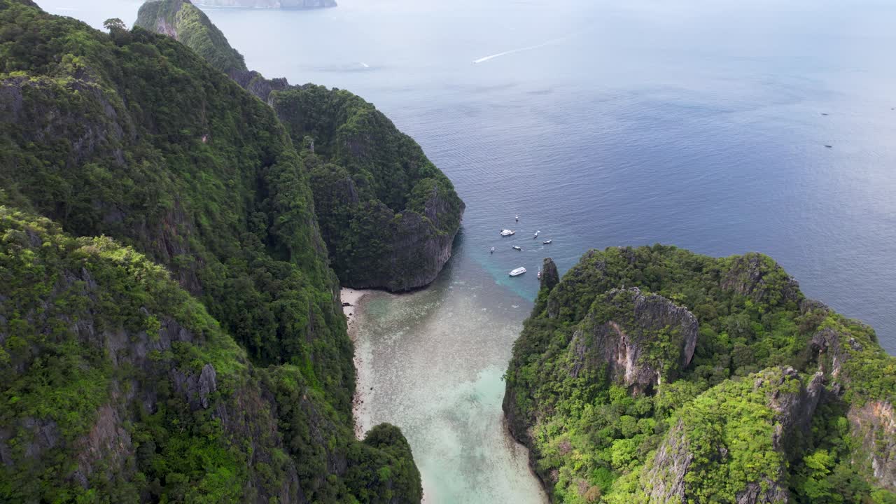 Koh Phi Phi Lee panoramic aerial of Maya Bay and Phi Leh Bay with turquoise water during the low tide. High quality 4k footage