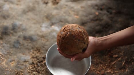 peeling coconut for making a coconut milk traditional making a coconut milk thailand