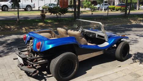 rear view of blue beach dune buggy, custom fiberglass, engine and muffler