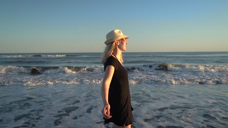 Happy-Girl-Having-Fun-At-The-Beach-On-Summer-Splashing-Waves-Of-Monte-Hermoso,-Buenos-Aires-In-Argentina