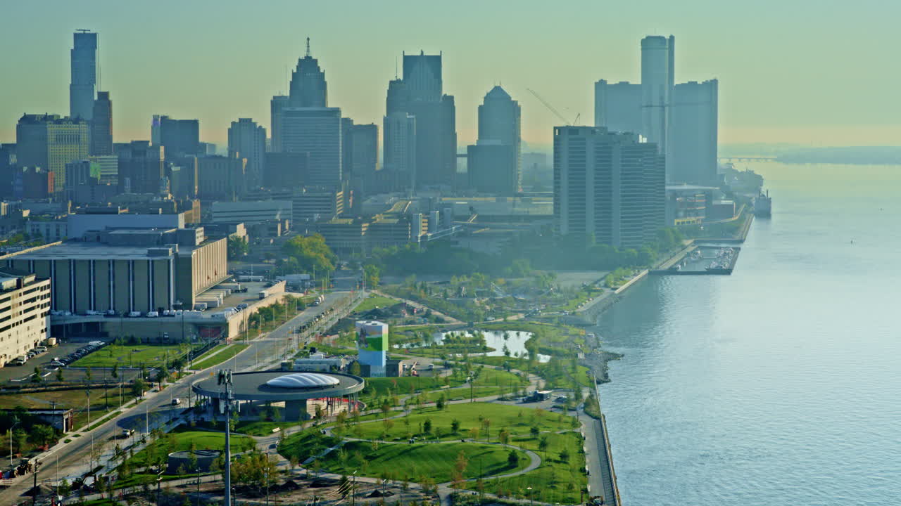 Drone shot flying towards Detroit skyline