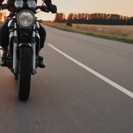 A-motorcyclist-rides-a-motorcycle-before-sunset-5