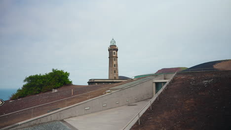 lighthouse of ponta dos capelinhos in the volcanic portuguese islands of faial in the azores, north atlantic ocean, portugal
