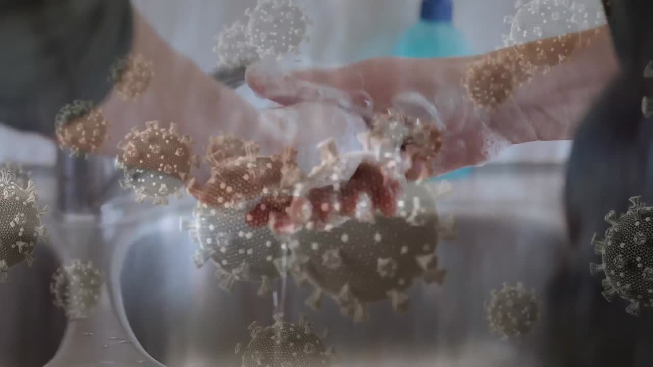 손을  ⁇ 는 사람 위의 코로나 19 세포의 애니메이션