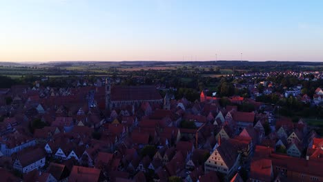 a drone flies over the old town beautiful panorama at sunset aerial view