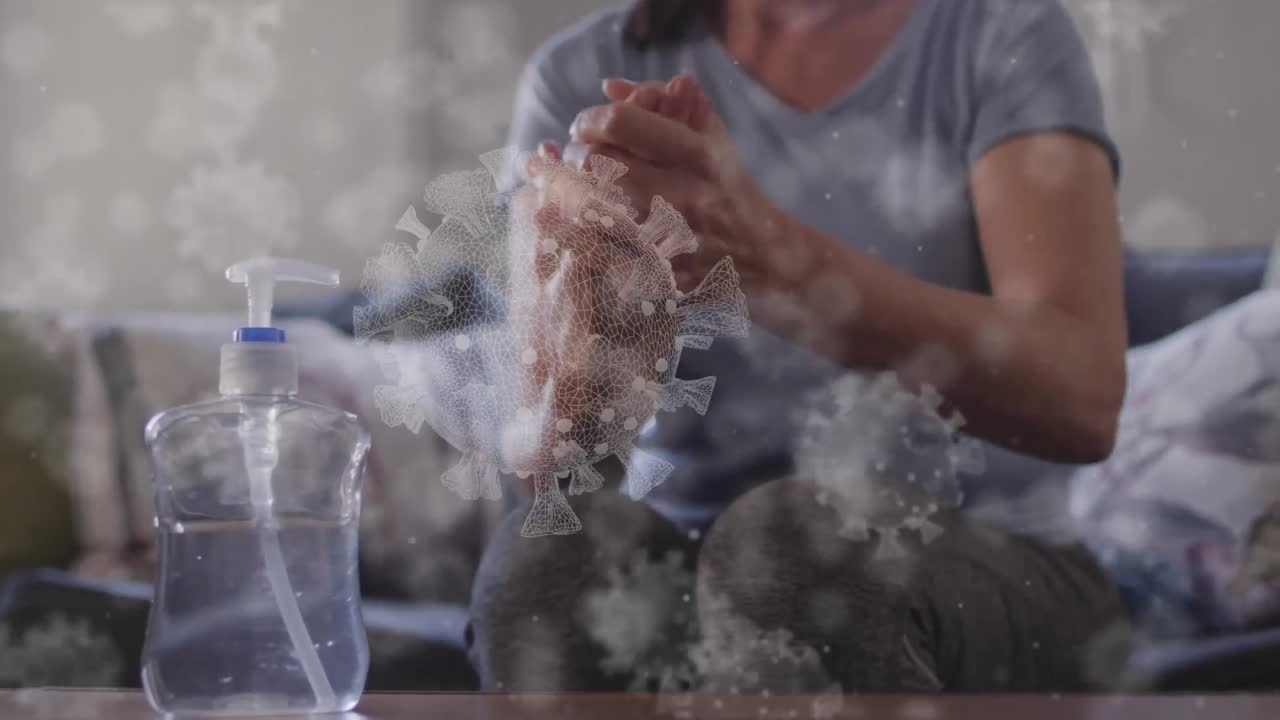 손을  ⁇ 는 사람 위의 코로나 19 세포의 애니메이션