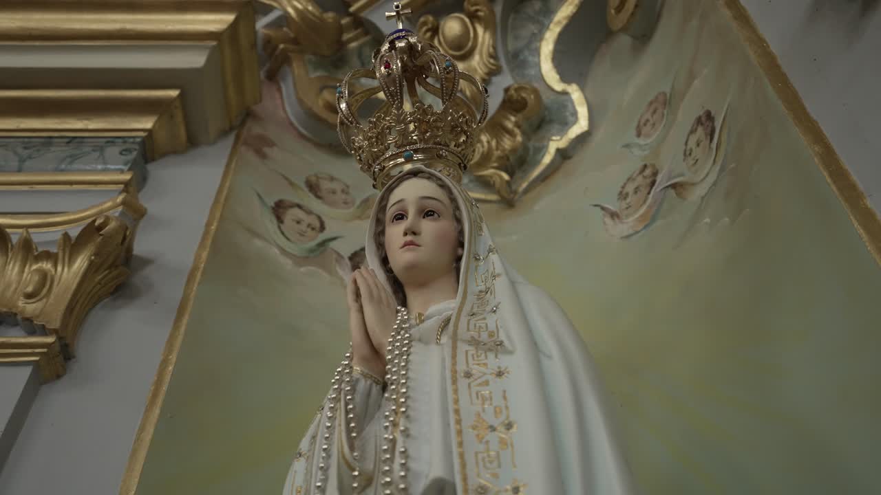 Statue of Virgin Mary with crown and angels