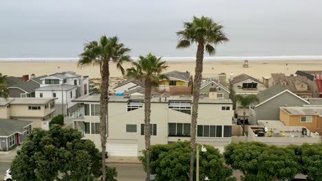 parallax ariel view of beachfront luxury homes overlooking the ocean