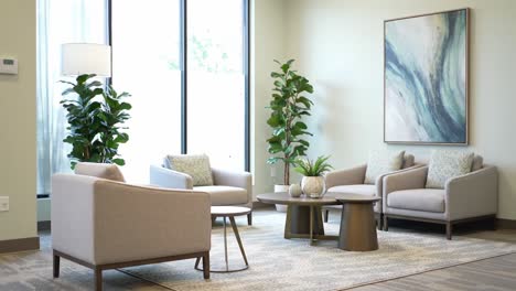 stylish interior design of a modern waiting room featuring cozy seating, elegant decor, and lush greenery for a calm atmosphere