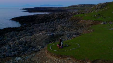 evening meditation session by the sea. aerial parallax