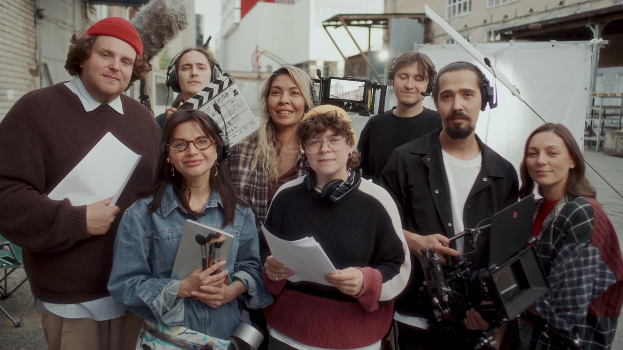 Group Portrait of Creative Film Production Team on Outdoor Movie Set