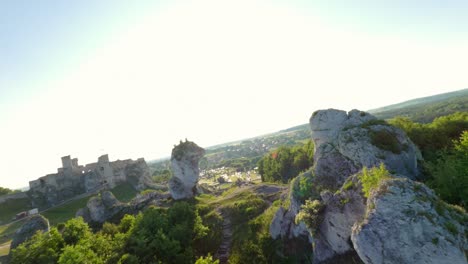 Aerial-flyover-towards-and-around-the-ruins-of-the-Zamek-Ogrodzieniec-medieval-castle-in-in-Podzamcze-near-Ogrodzieniec,-Poland