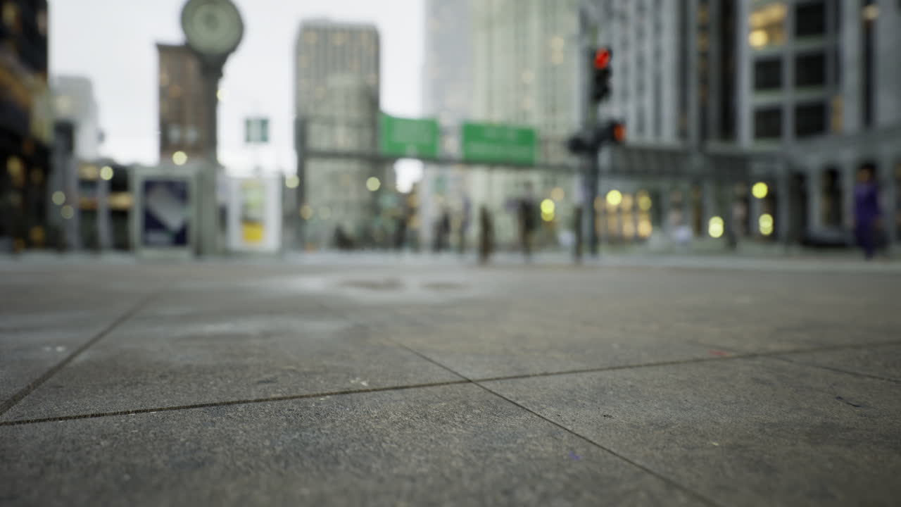 Crowded urban street buzzing with activity during a rainy afternoon