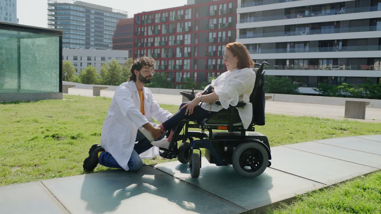 Doctor assisting a patient in a wheelchair