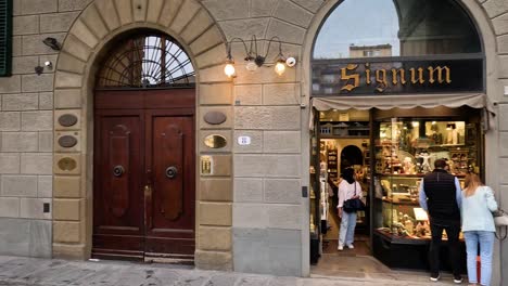 people entering and exiting a shop