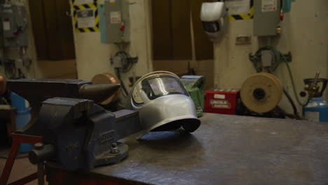 welding shop mask on a table in classroom