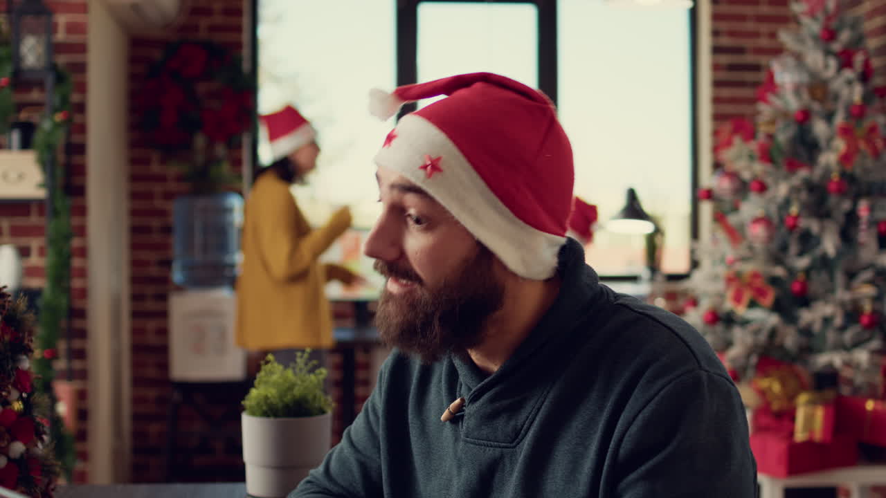 Male employee talking on online videoconference call