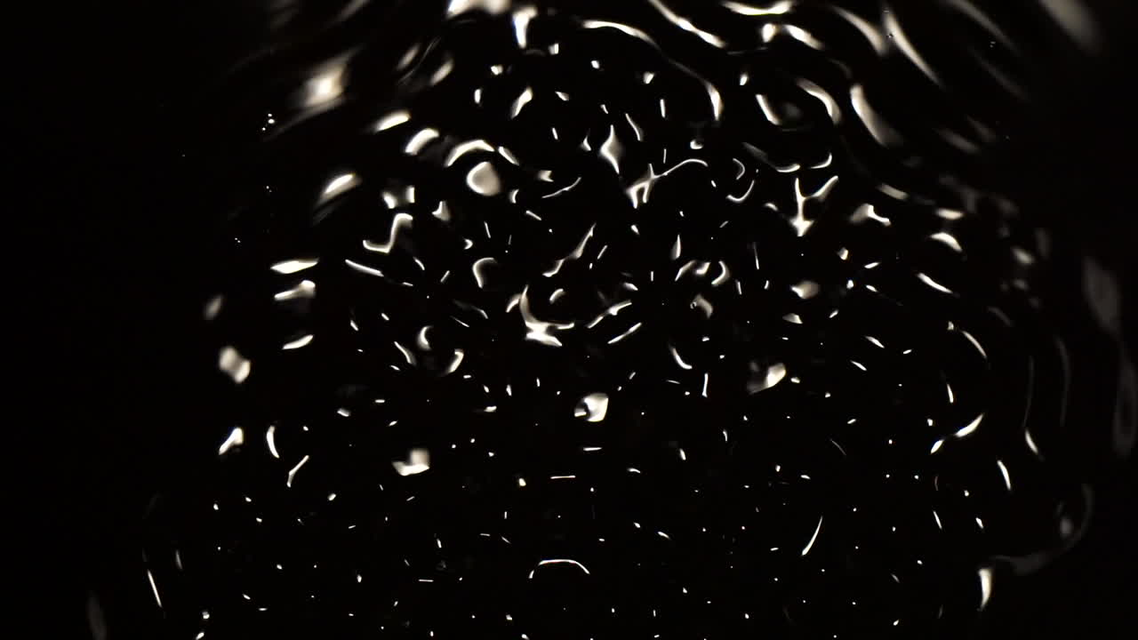Pulsing wave patterns fluctuate in black space