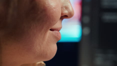 Extreme-closer-up-shot-of-smiling-computer-engineer-working