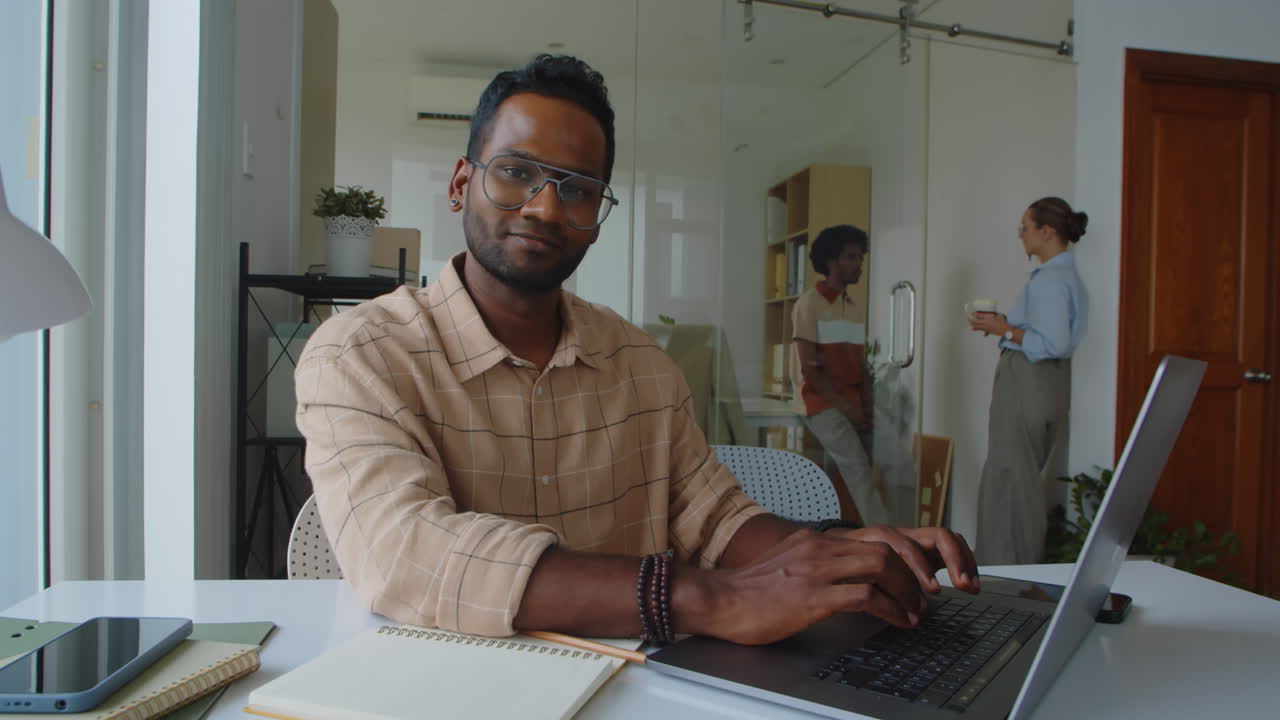 Portrait of Young Asian Programmer Working in Office