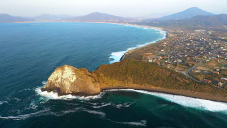 Wide-rotating-drone-shot-of-the-coastline-at-Kyushu-Japan