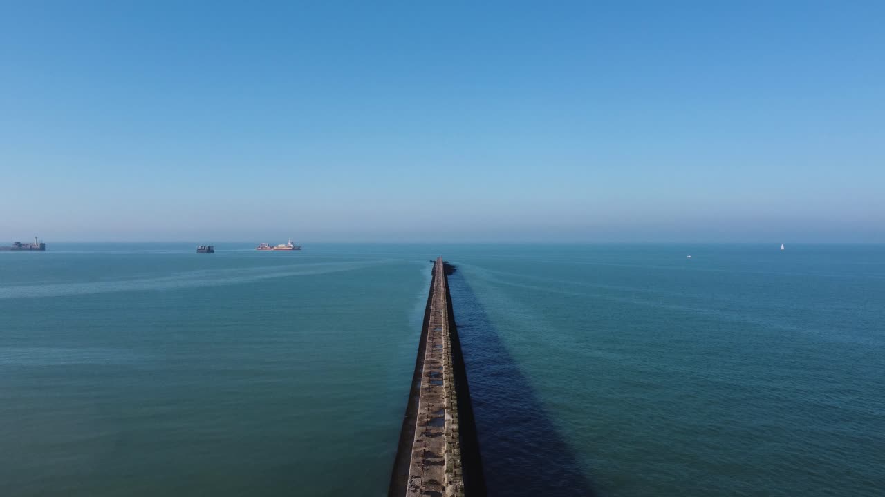 Aerial View of Breakwater in Calm Sea