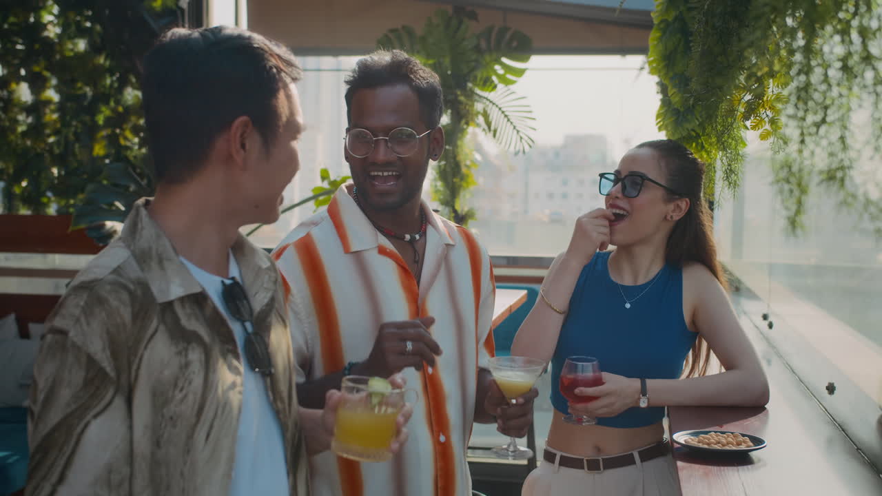 Group of Colleagues Enjoying Cocktails in City Bar