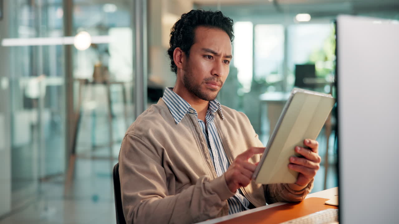 Focused Man Using Digital Tablet in Modern Office