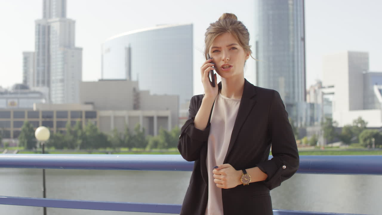 Emotional Business Woman Having Phone Call Outside