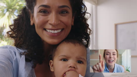mother and baby video chatting with friend using webcam enjoying communicating on video chat
