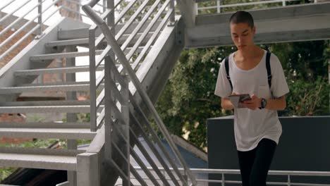 man using digital tablet while moving upstairs 4k