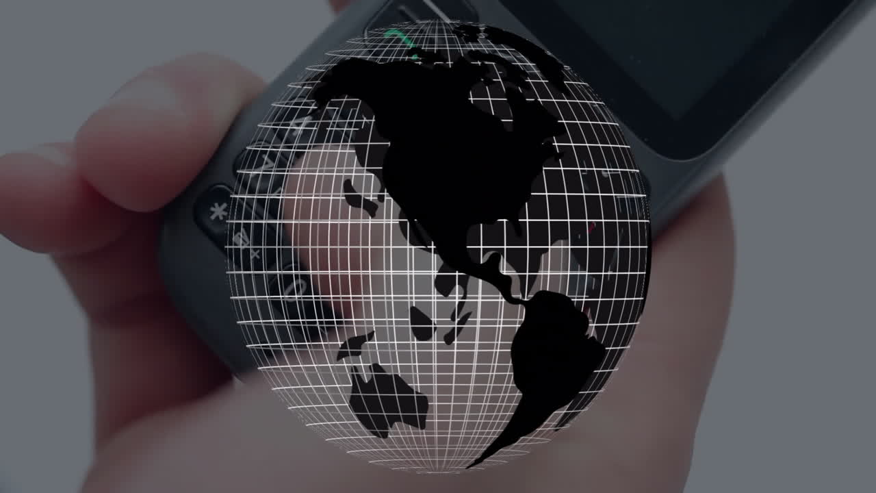 Hand holding electronic device projecting transparent 3D grid globe against blurred studio backdrop