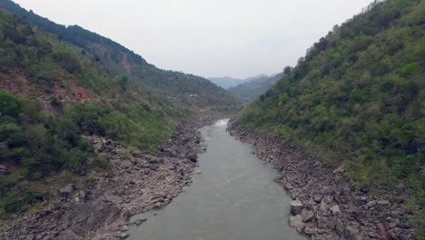 a beautiful river between the mountains and a road making an imaginary view