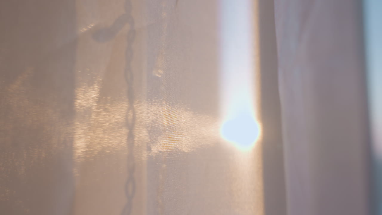 Soft Rays Illuminate City Through Window, Sunlight Gently Seeps Through Curtains Onto Peaceful Space, Calm Cityscape Revealed By Gentle Sunlight Filtering Through Delicate Fabric Curtains