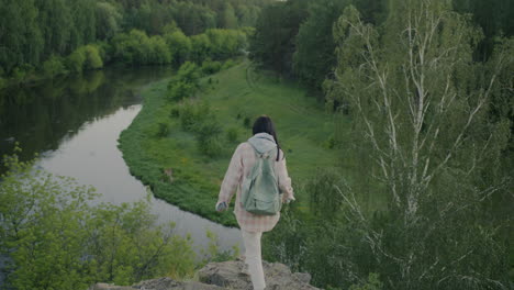 Woman Hiking in Scenic Forest and River Valley