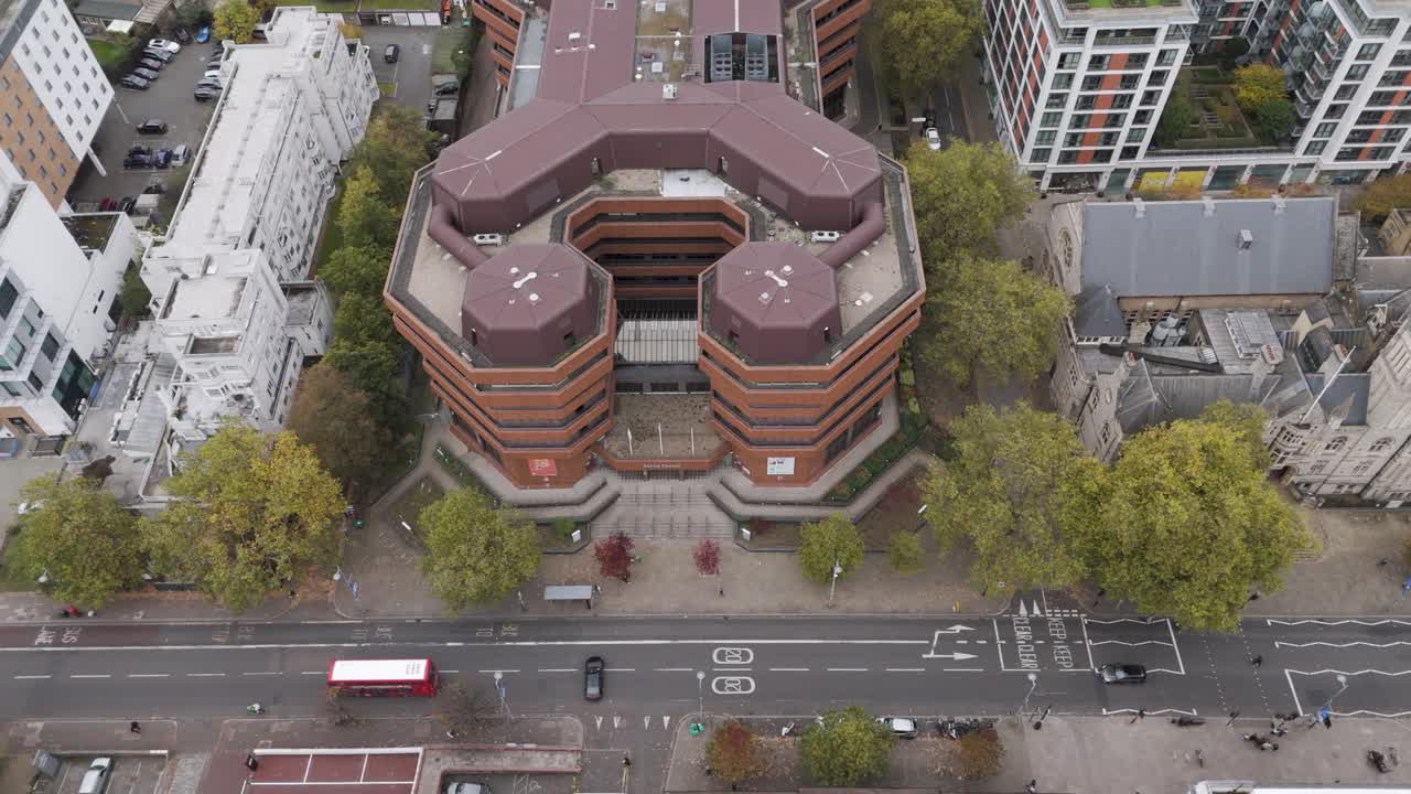 Aerial orbital view of Ealing Council HQ building, with unique architecture and surrounded by urban infrastructure, Ealing, London, UK, October 2024