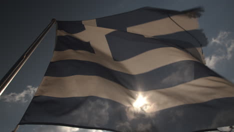 close up of a greek flag waving in the wind in slow motion