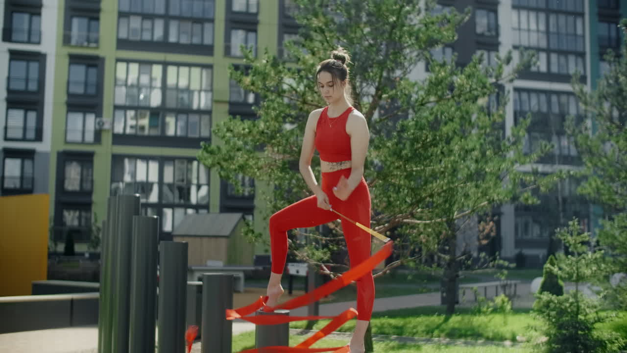 Woman Performing Ribbon Dance Outdoors