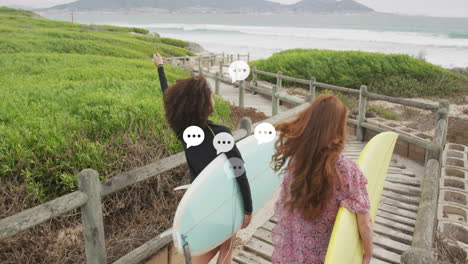 speech bubbles animation over two women walking with surfboards towards beach