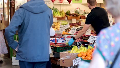 people buying fruits and vegetables