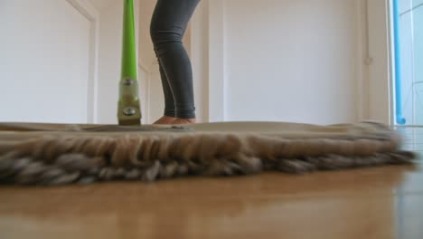 cleaning floor with mop