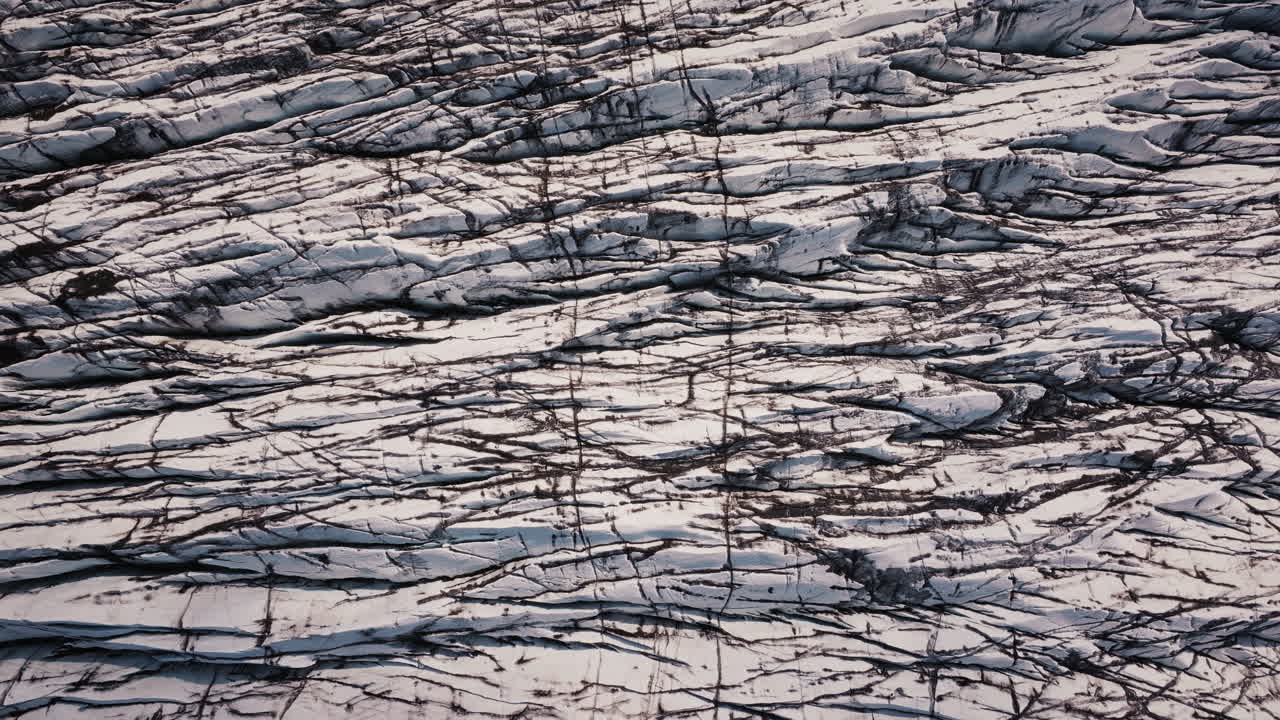 Aerial View of a Glacier with Crevasses