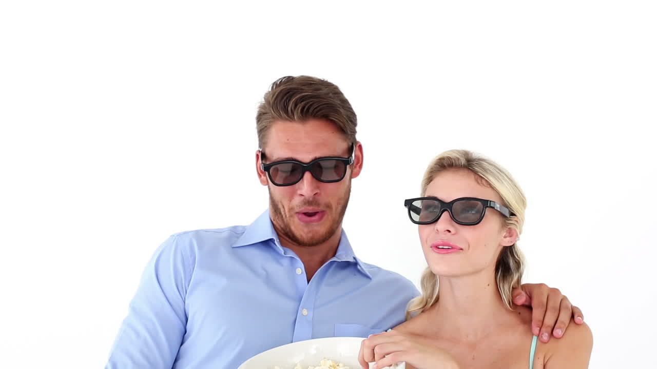 Attractive young couple watching a 3d movie