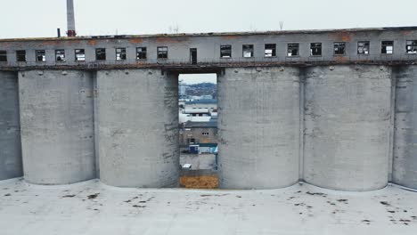 old abandoned factory with concrete pipes and broken windows. chemical plant storage. aerial view