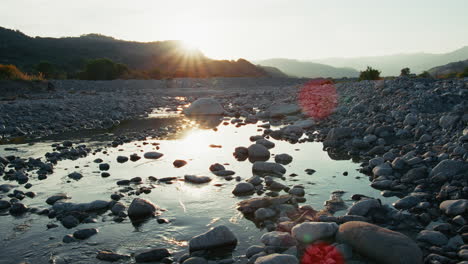 the passage of time compared to the slow flow of the river at sunset